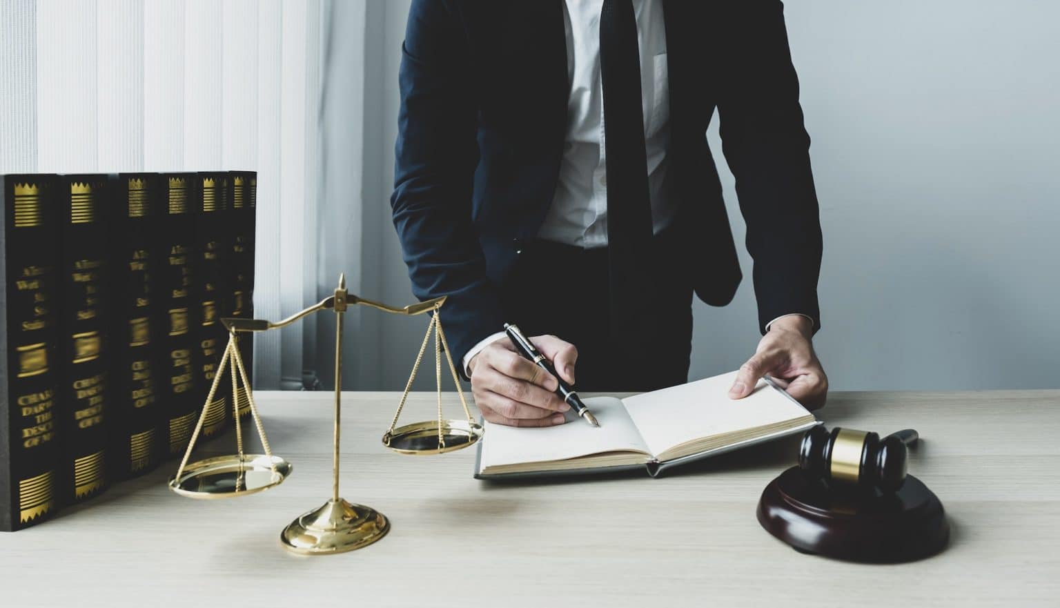 lawyer-hand-holding-pen-and-providing-legal-consult-business-dispute-service-at-the-office-1536x881
