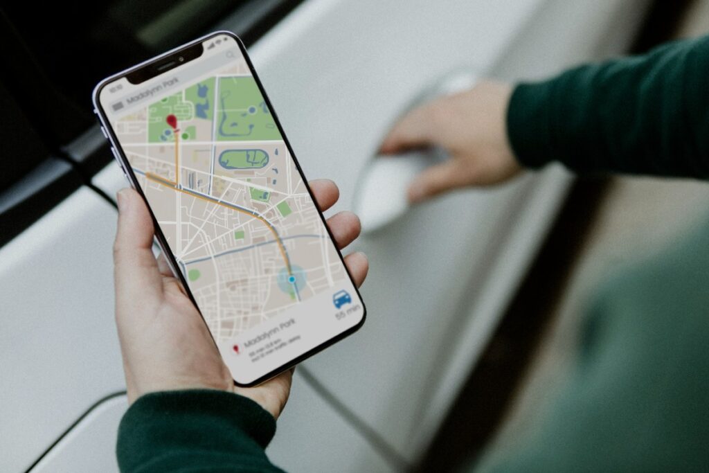 Smartphone displaying Google Maps local business search results with multiple location pins and business listings