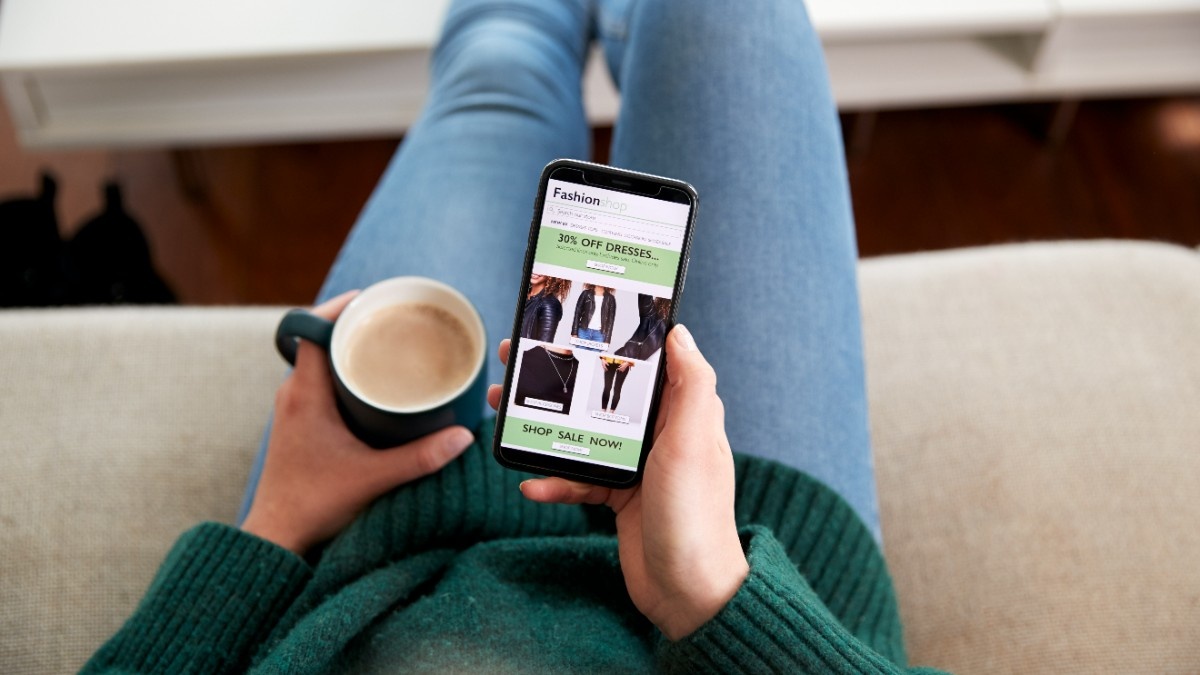 Smartphone showing mobile ecommerce interface with product browsing and checkout