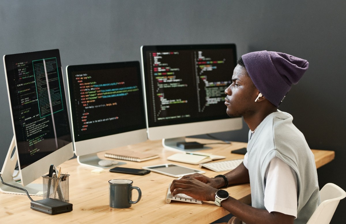 Computer screen showing website code, HTML, and technical programming elements